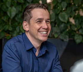 man smiling in office