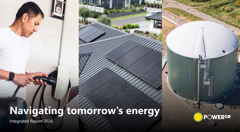 man plugging in EV car charger solar panels on roof bio digester