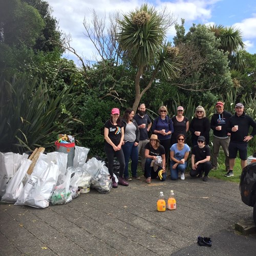 Powerco staff with bags of collected rubbish