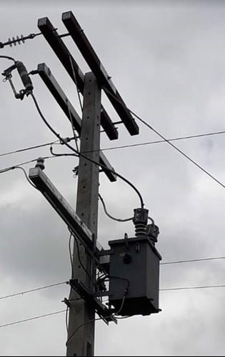 Overhead line cross-arm with a falcon cover