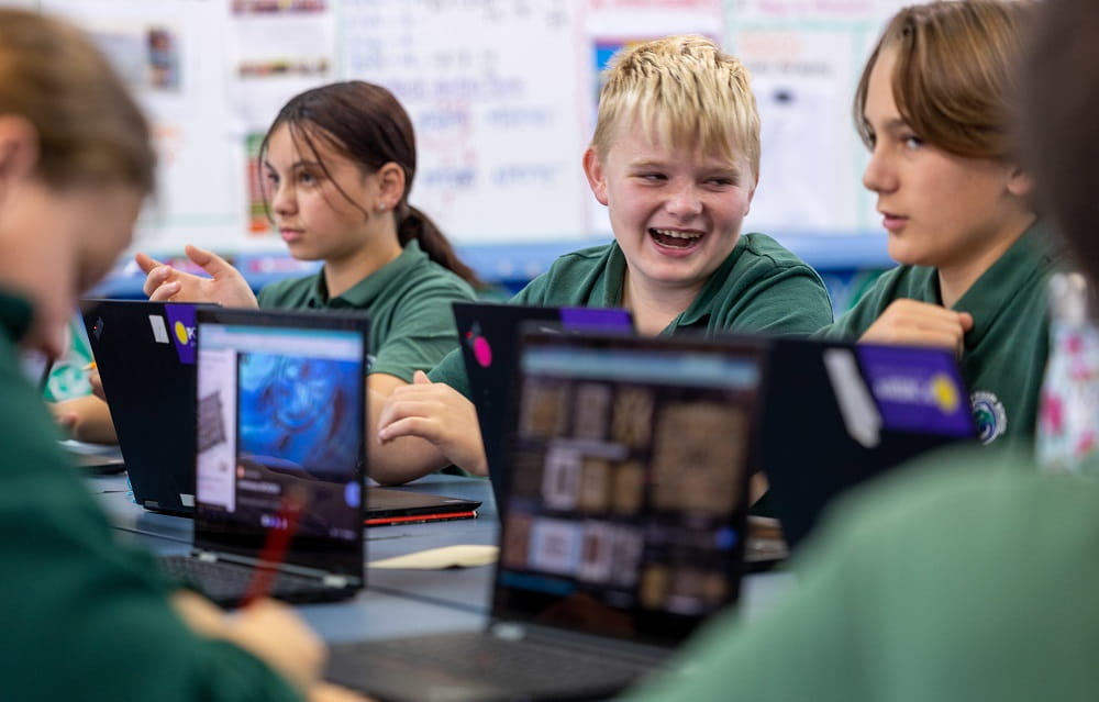 Left to right: Jasmine Rongo-Liddle, Mason Diprose and Harry McLoughlin with their Powerco laptops.