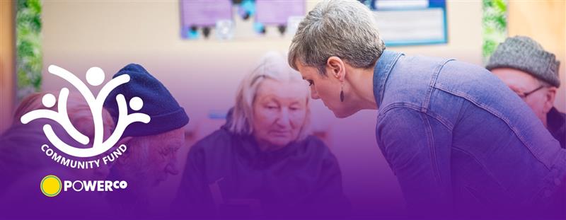 people talking in a community hall
