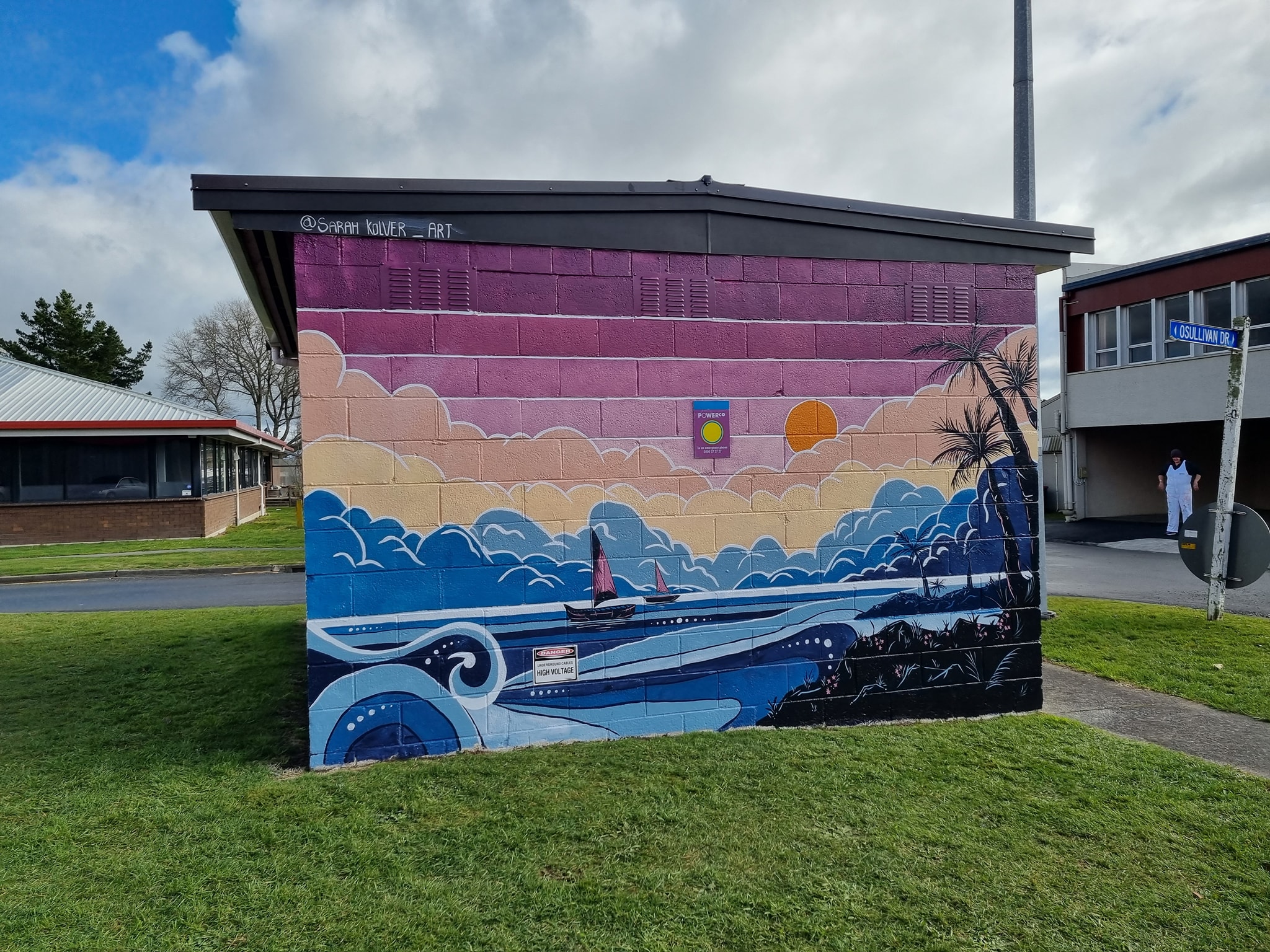 Mural of sea and sky in a Pacific Island setting.