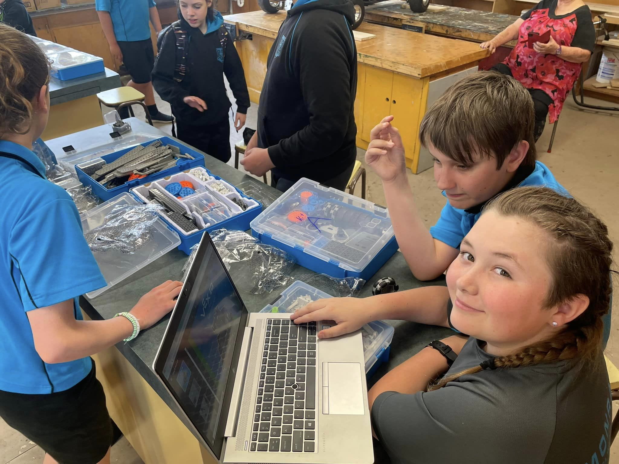 Primary school children using Kiwibots kits