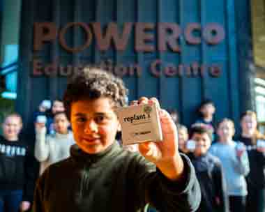 child holding seed packet