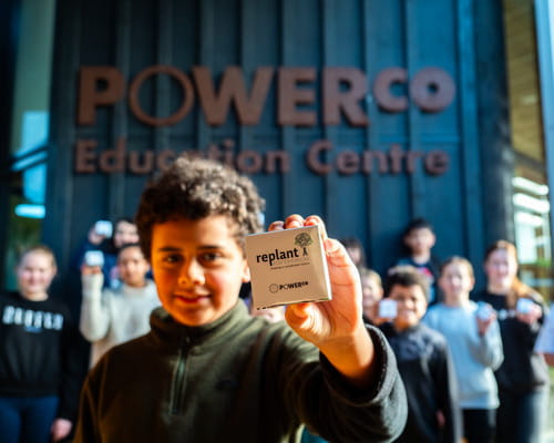 Child holding replant for tomorrow seedlings