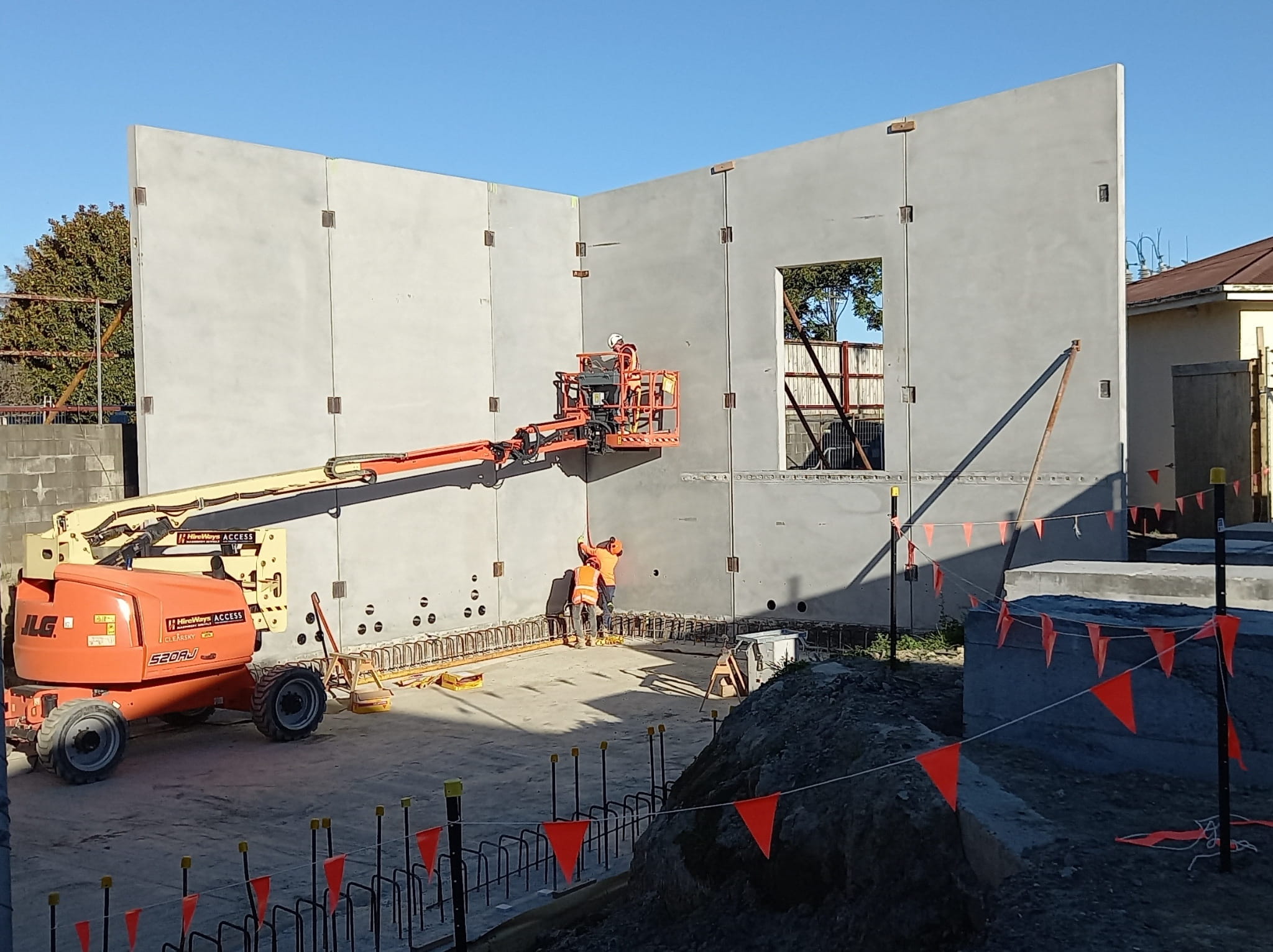 Two large concrete wall panels showing the start of a building under construction