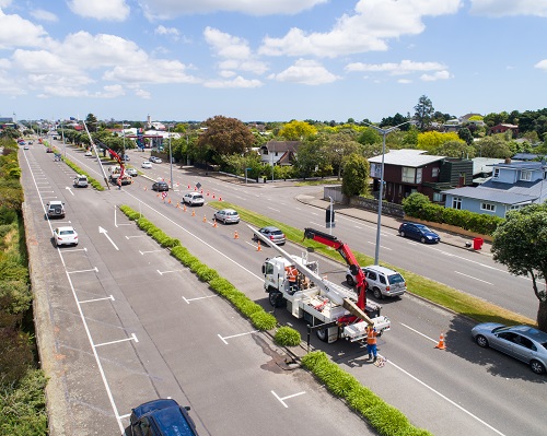 Bird's eye view of Palmerston North's Main St with trucks removing power poles and lines