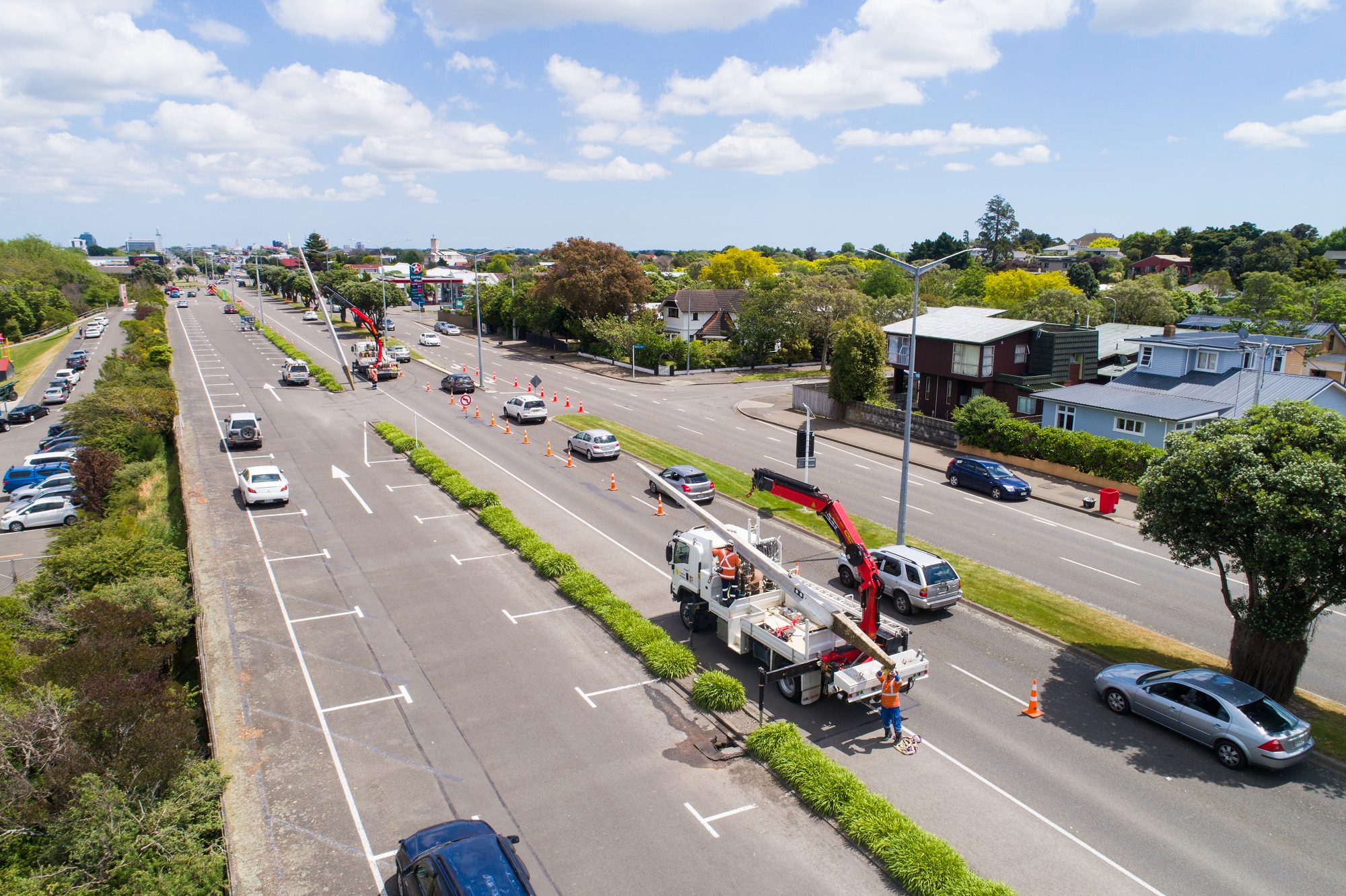 Bird's eye view of Main St, Palmerston North, showing a work truck and cars.