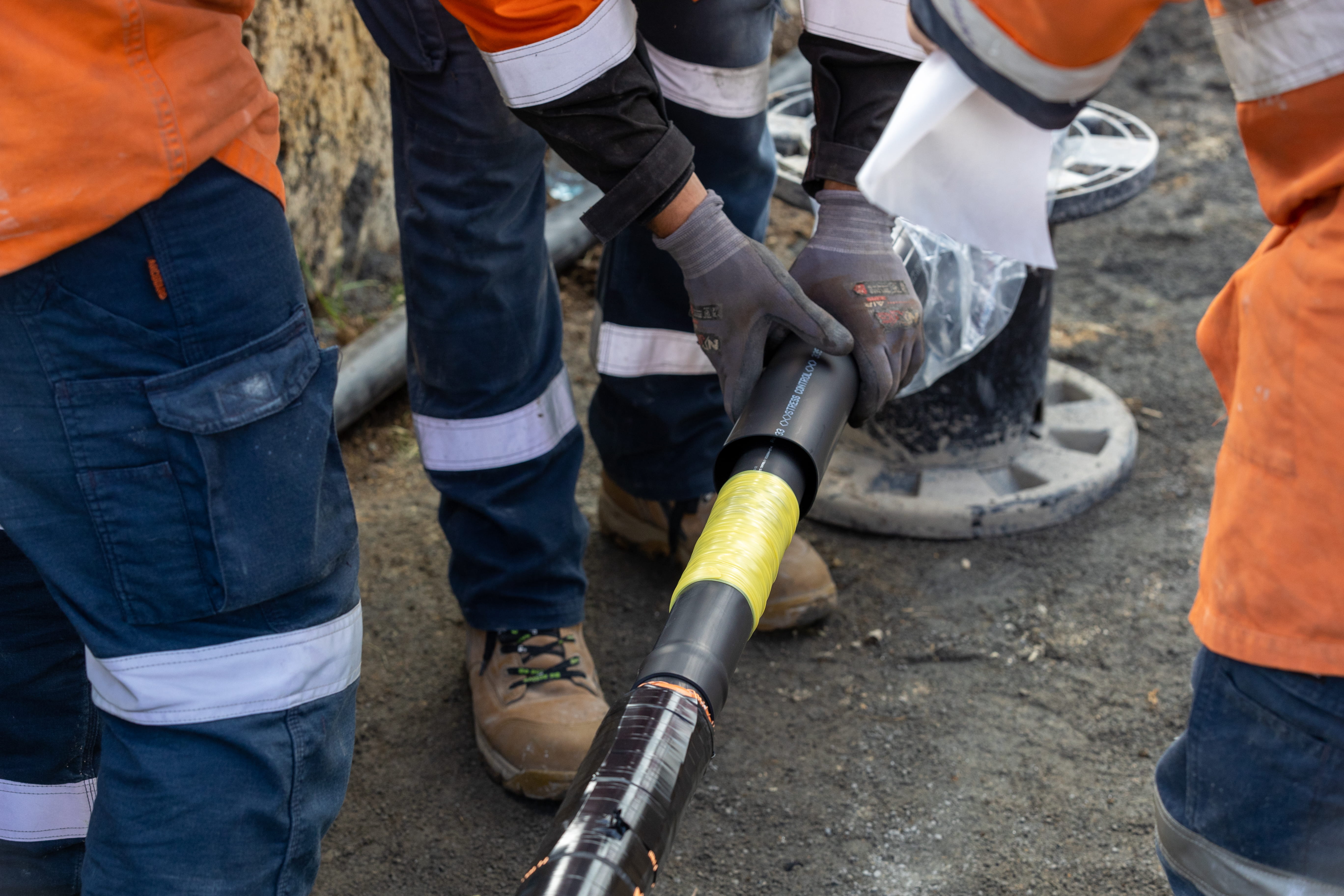 Fields crews doing cable jointing in a trench
